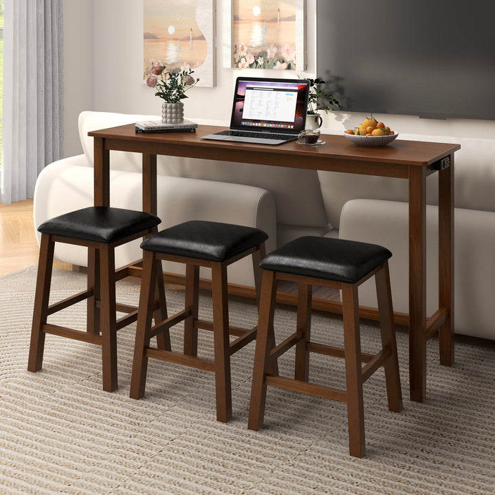 Counter-height bar table with three black cushioned stools, light brown wood legs
