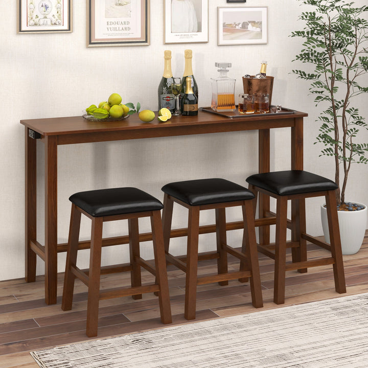 Brown bar table with three black cushioned stools underneath, wood construction