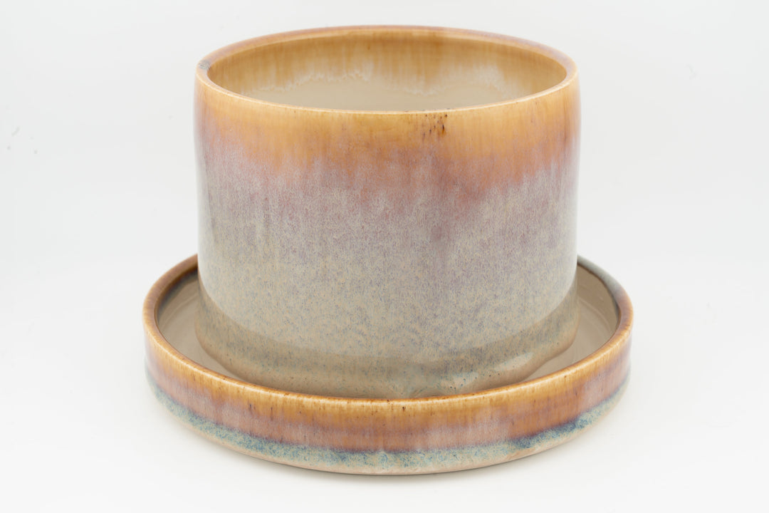 Tabletop planter set with drainage, peach and light blue glazed pot on matching tray.