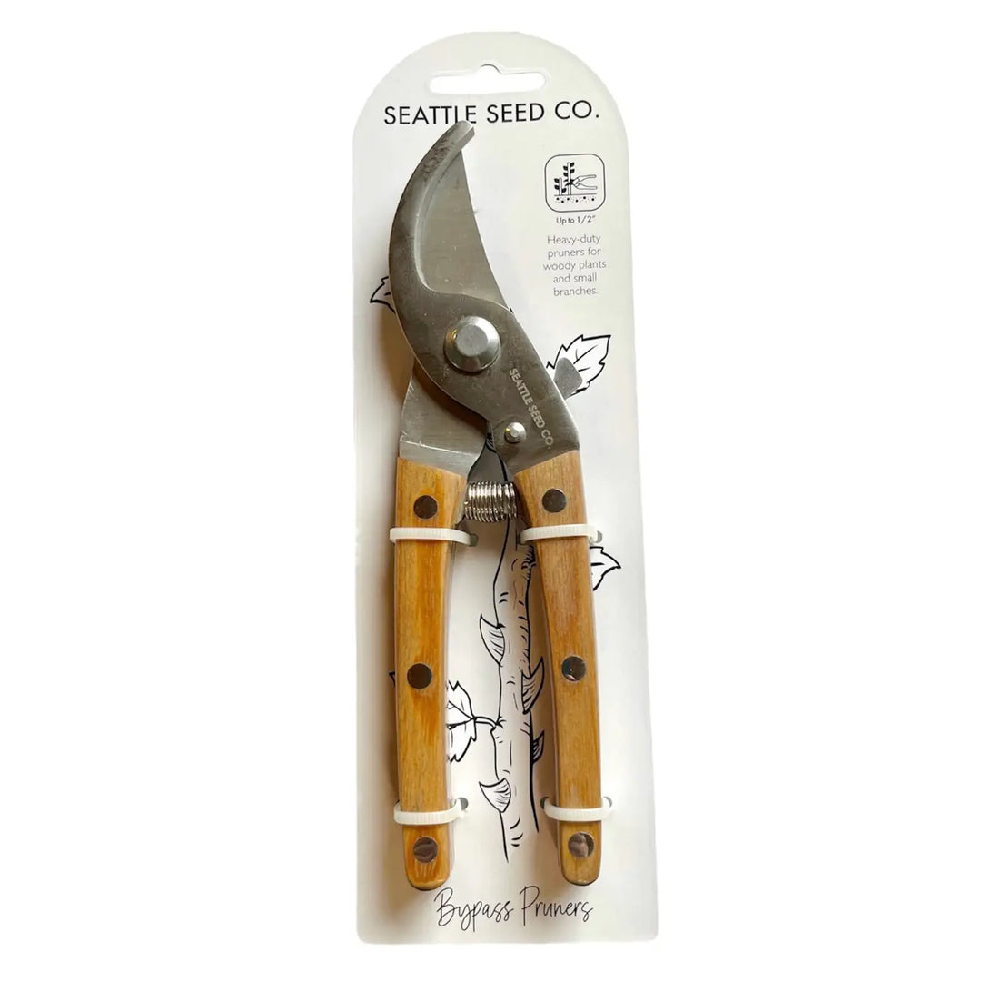 Bypass pruners with wooden handles on retail card packaging