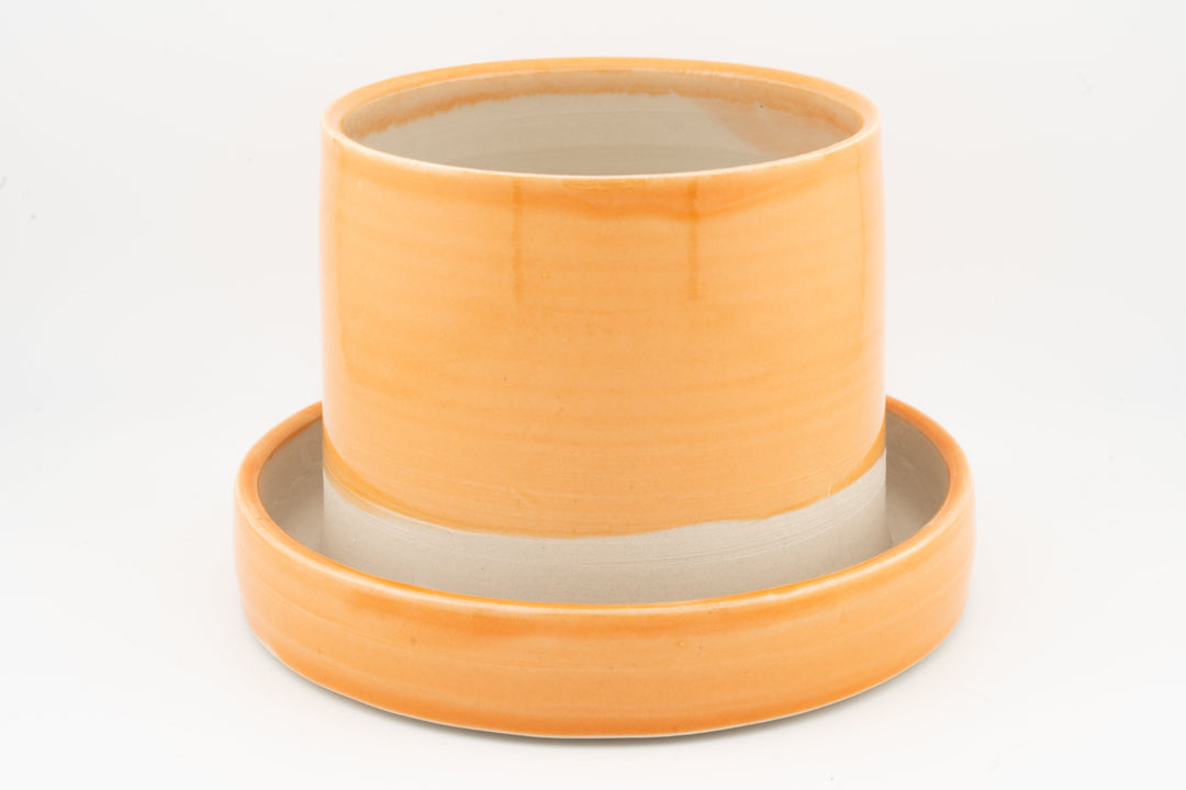 Orange tabletop planter set with drainage base, two stacked pots