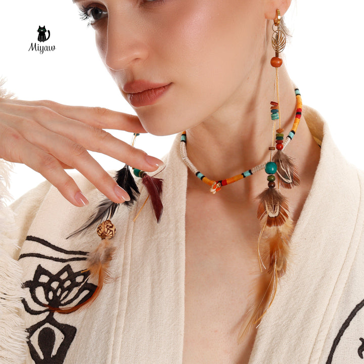 Beige cotton kimono robe neckline and shoulder close-up with black moon-and-yoga print