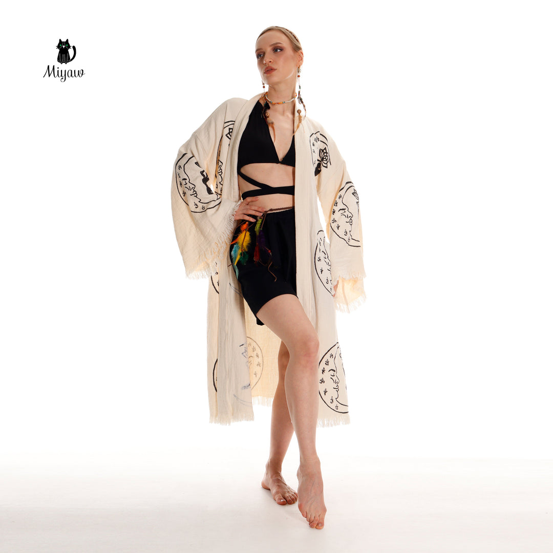 Beige cotton kimono robe open over black outfit, black yoga-girl and moon prints