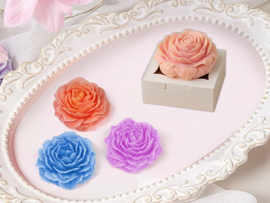Set of four wax flower fresheners: peach, pink, blue, and purple in a decorative tray
