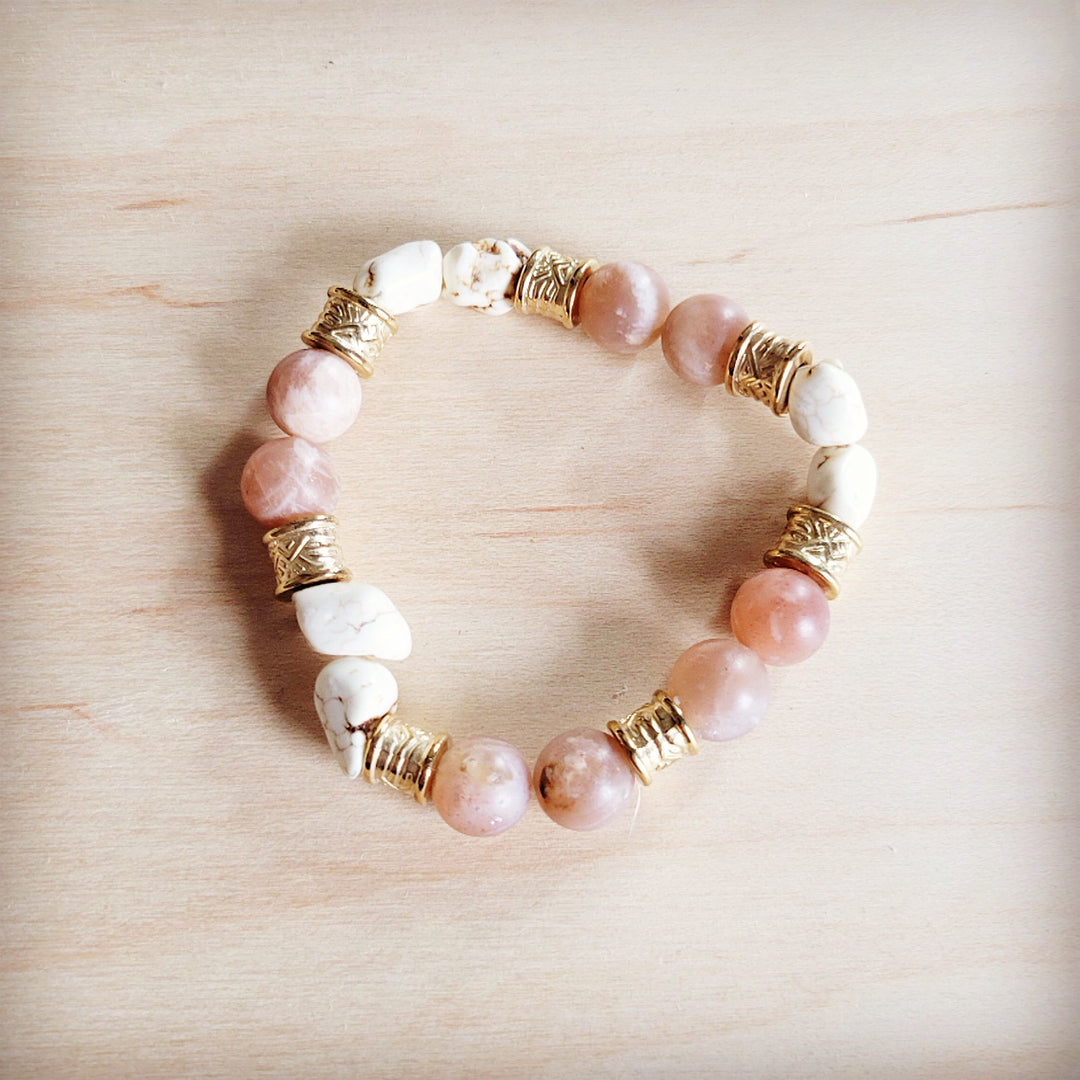 Stretch beaded bracelet with pink and white beads and gold-tone barrel spacers