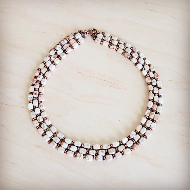 Triple-strand beaded boho necklace with white and dark bronze cube beads and copper chain