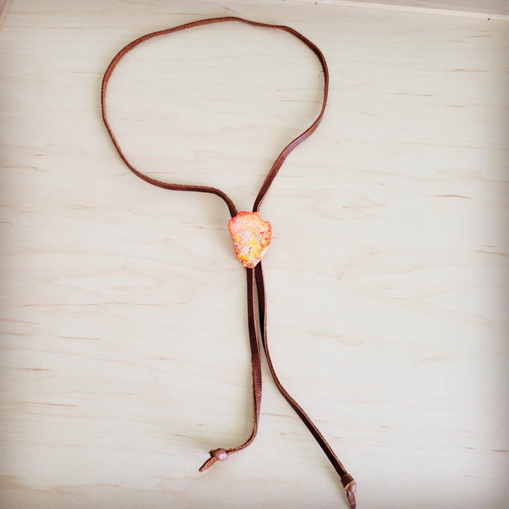 Leather lariat necklace with orange Regalite slab pendant on brown cord