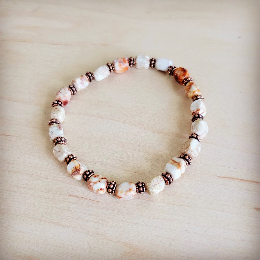 Sandstone and copper stretch beaded bracelet with white oval stones and black spacer beads