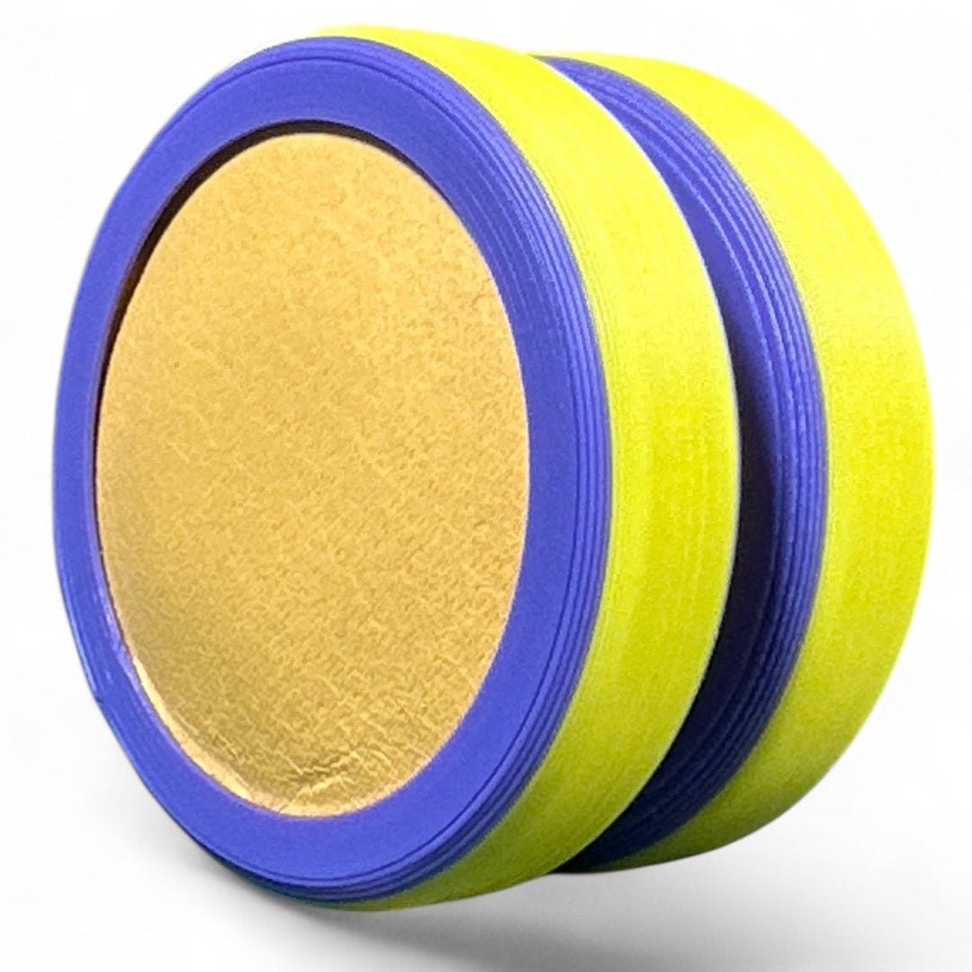 Pride Moons stacked disc bands in yellow, blue, and violet stripes around a tan center