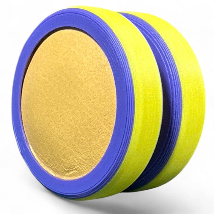 Pride Moons stacked disc bands in yellow, blue, and violet stripes around a tan center