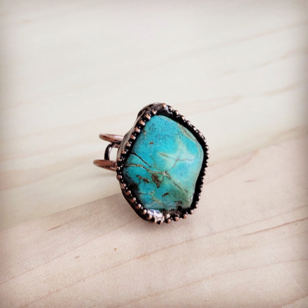 Antique copper ring with oval natural turquoise stone and beaded border