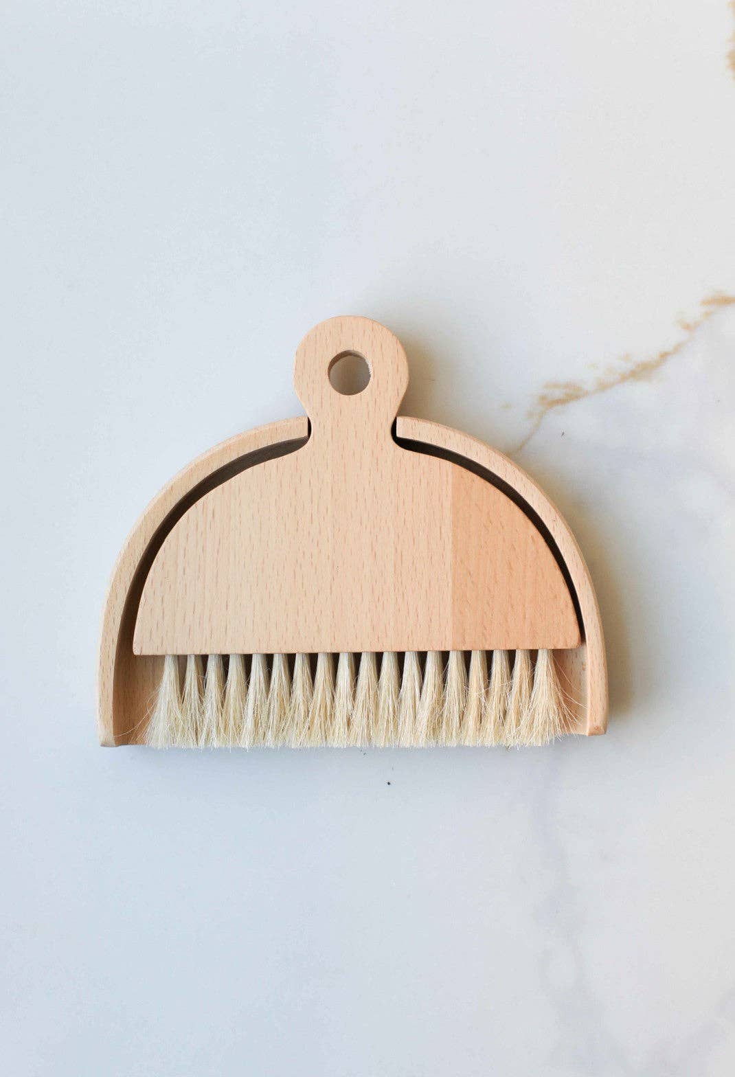 Table brush with loop handle, light wood body, dense tan bristles