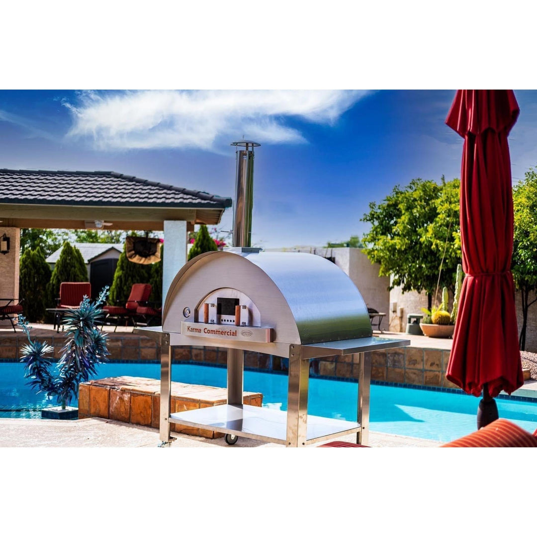 Outdoor wood-fired stainless steel oven with arched dome and front access opening