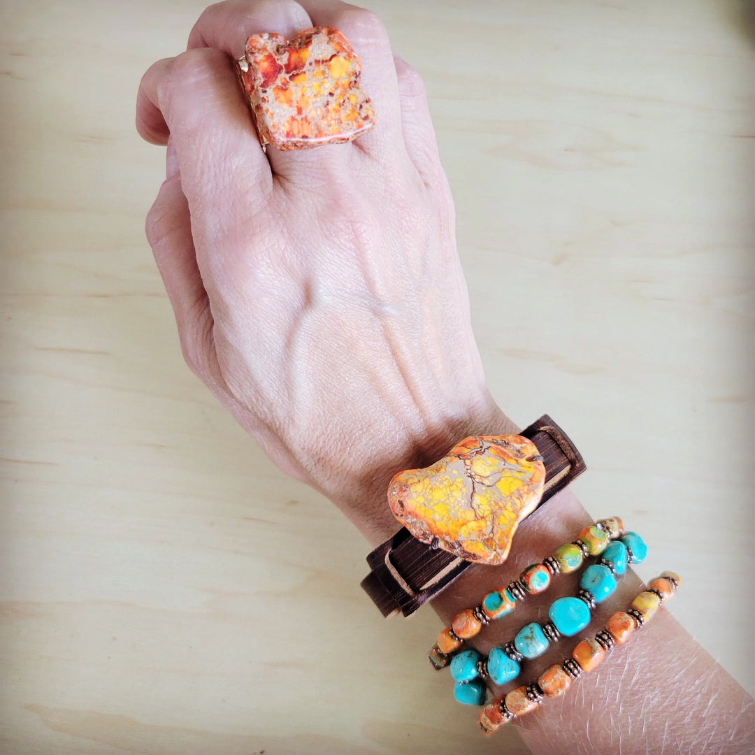 Orange marbled resin statement ring on gold-tone open band
