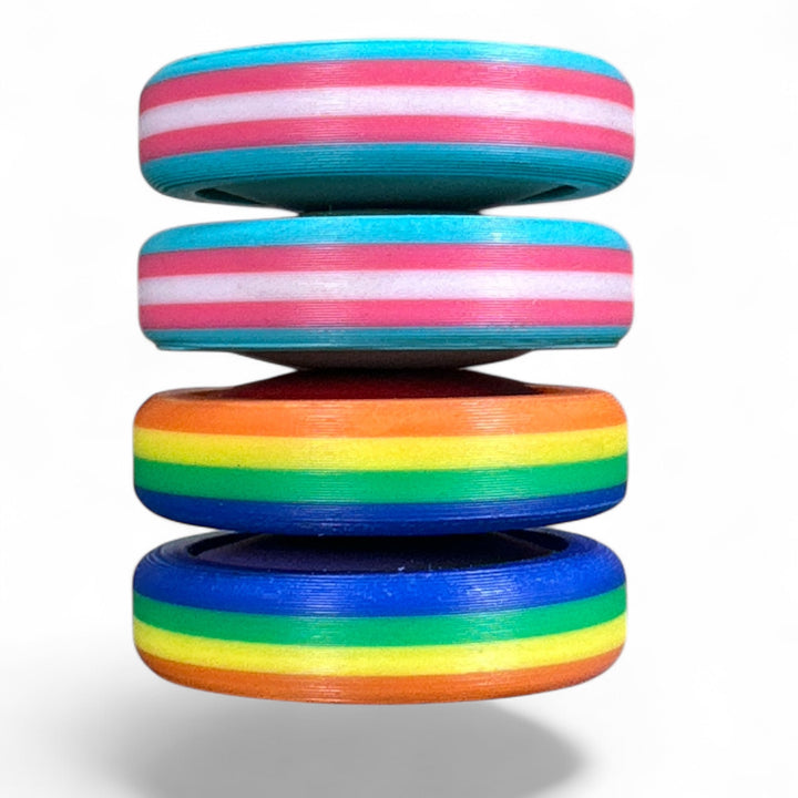 Stack of pride rainbow striped round bands in turquoise, pink, orange, green, and blue