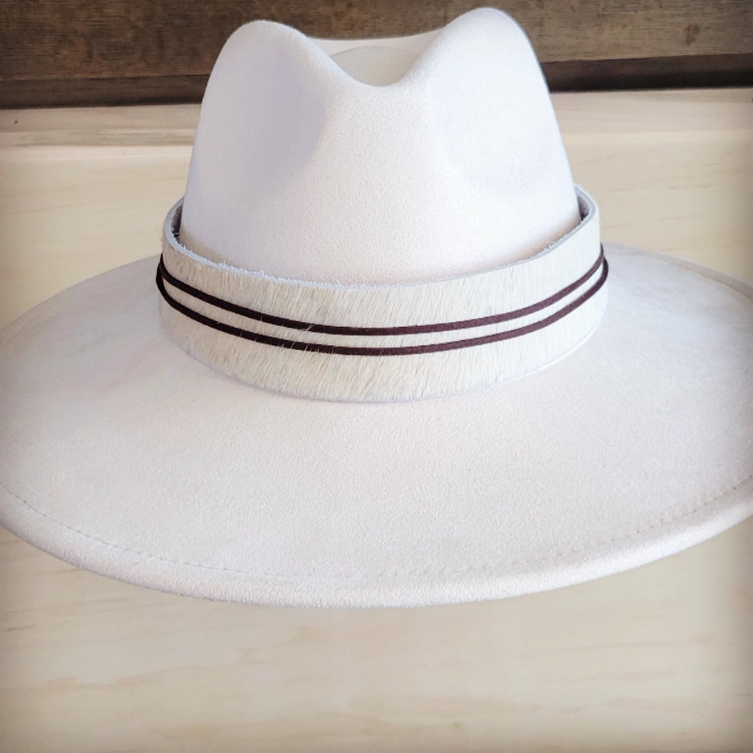 White wide-brim felt hat with dark band and textured trim