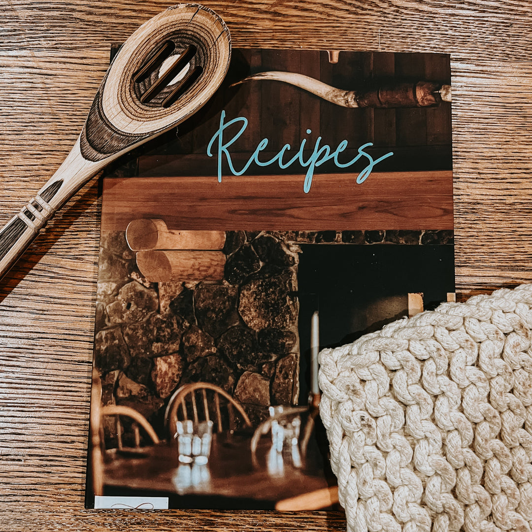 Recipe book with spiral binding and “Recipes” title on wood-toned cover