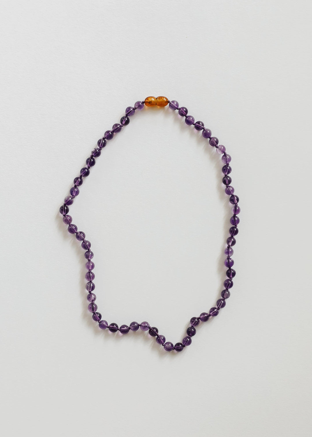 Amethyst bead necklace with small orange bead accents