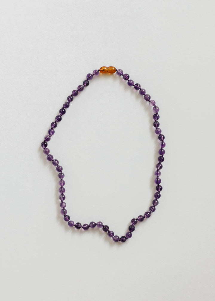 Amethyst bead necklace with small orange bead accents