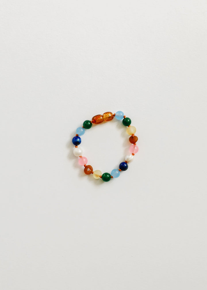 Beaded bracelet with multicolor round beads, white pearls, and pink accents