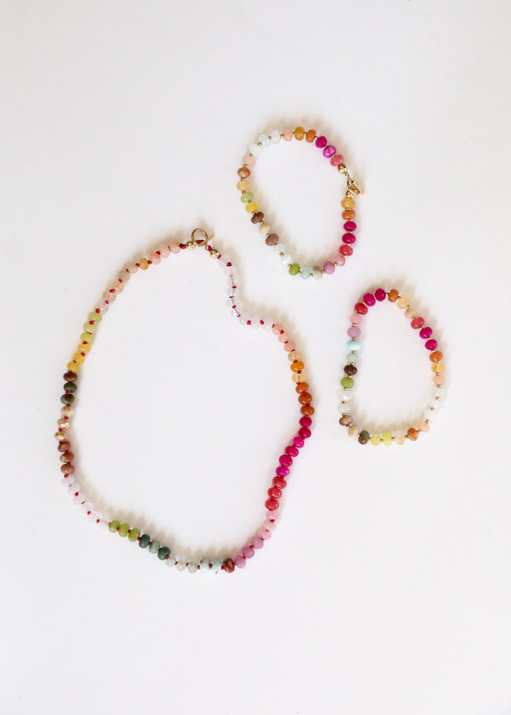 Three multicolor gemstone bead necklace strands with gold-tone accents