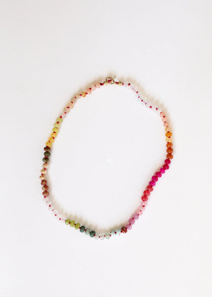 Multicolor gemstone bead necklace strand with gold-tone accents