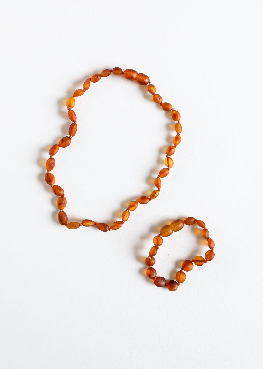 Cognac amber bead necklace set, long strand and shorter strand with faceted beads