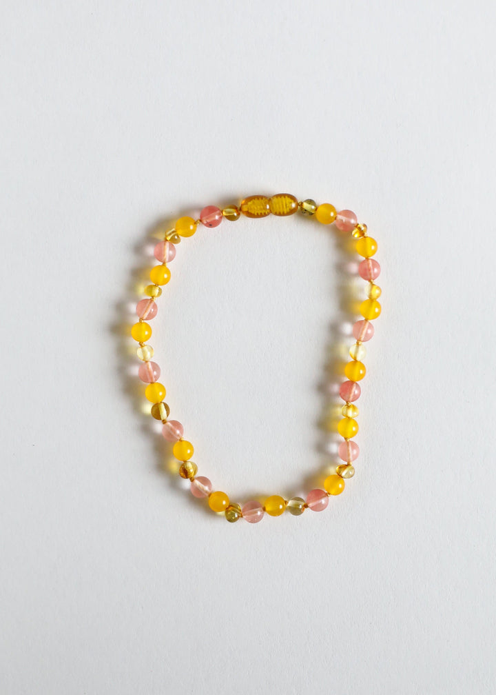 Beaded necklace with golden yellow and pink gemstone beads, oval and round beads