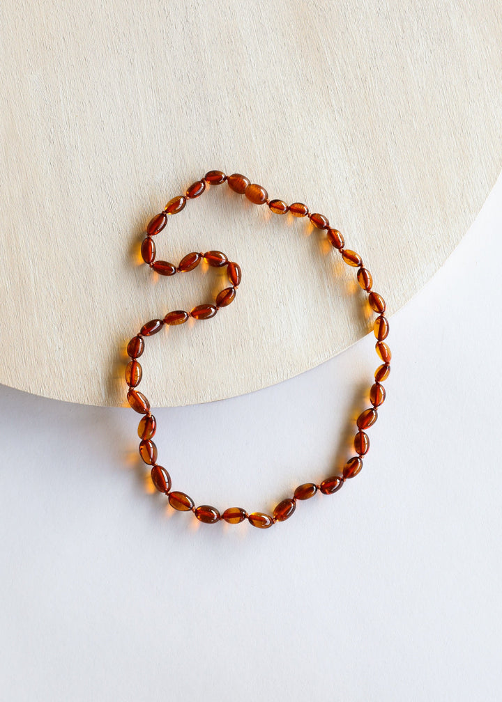 Cognac amber bead necklace with polished oval beads, linked chain strand