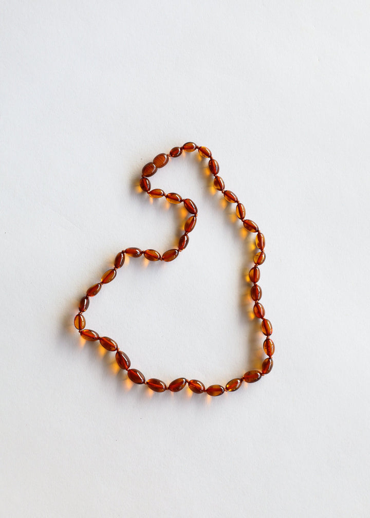 Cognac amber bead necklace, single strand of polished oval beads