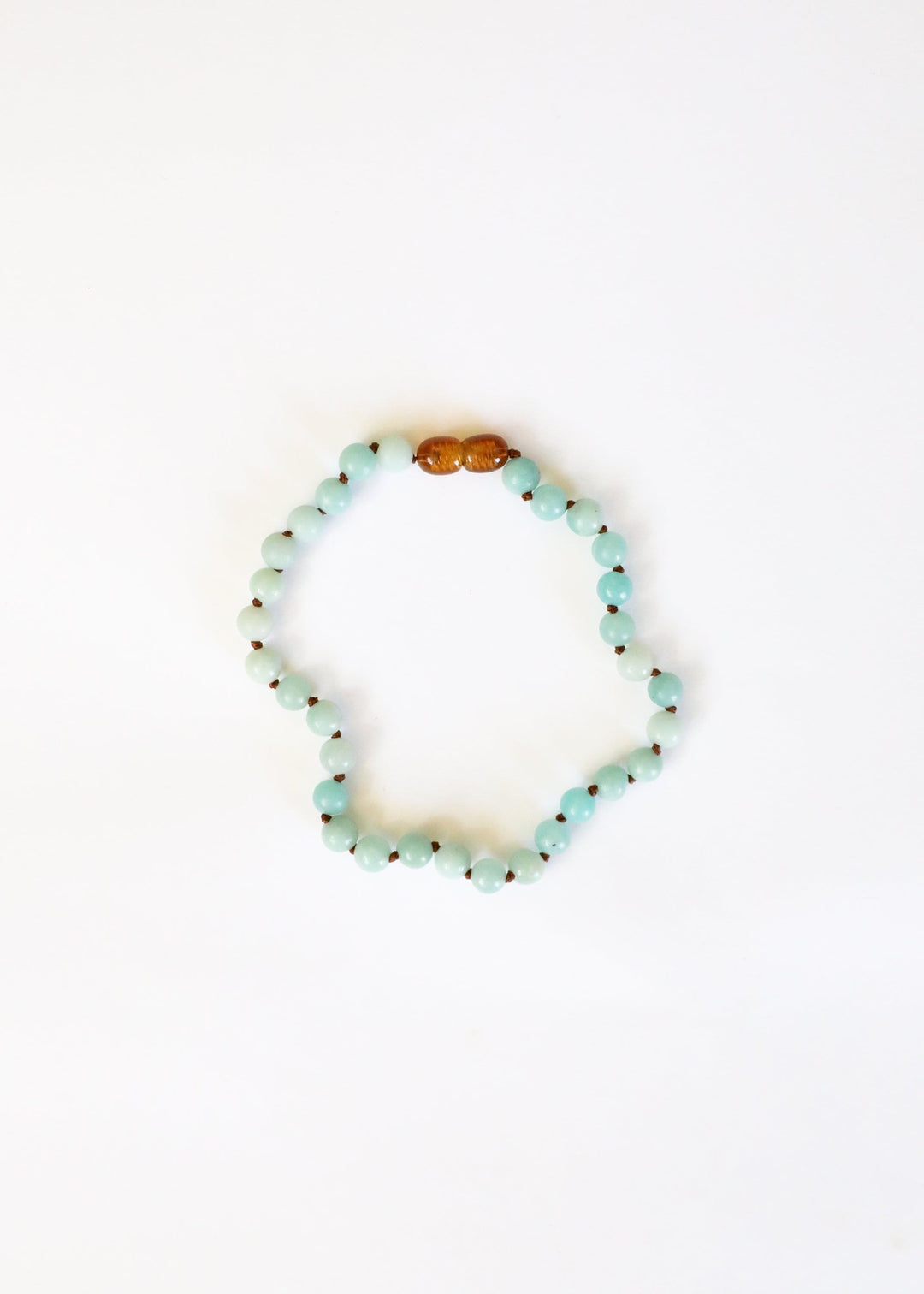 Amazonite beaded necklace with light blue round beads and amber accent bead on top