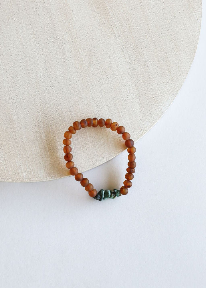 Amber-brown round-bead bracelet with green turquoise connector stones