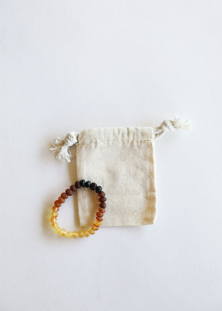 Raw ombré Baltic amber adult bracelet with yellow, orange, and dark beads