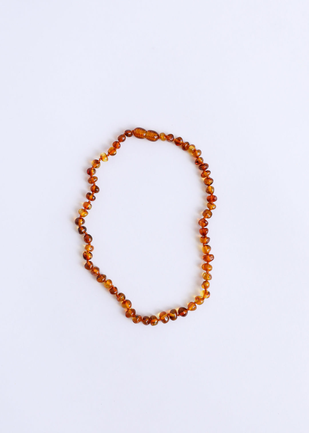 Cognac-orange polished amber bead necklace, round beads on string