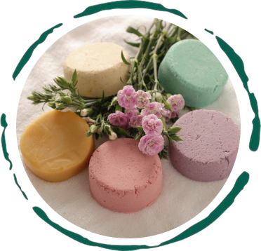 Shampoo bar set with round bars in beige, green, pink, and lavender tones