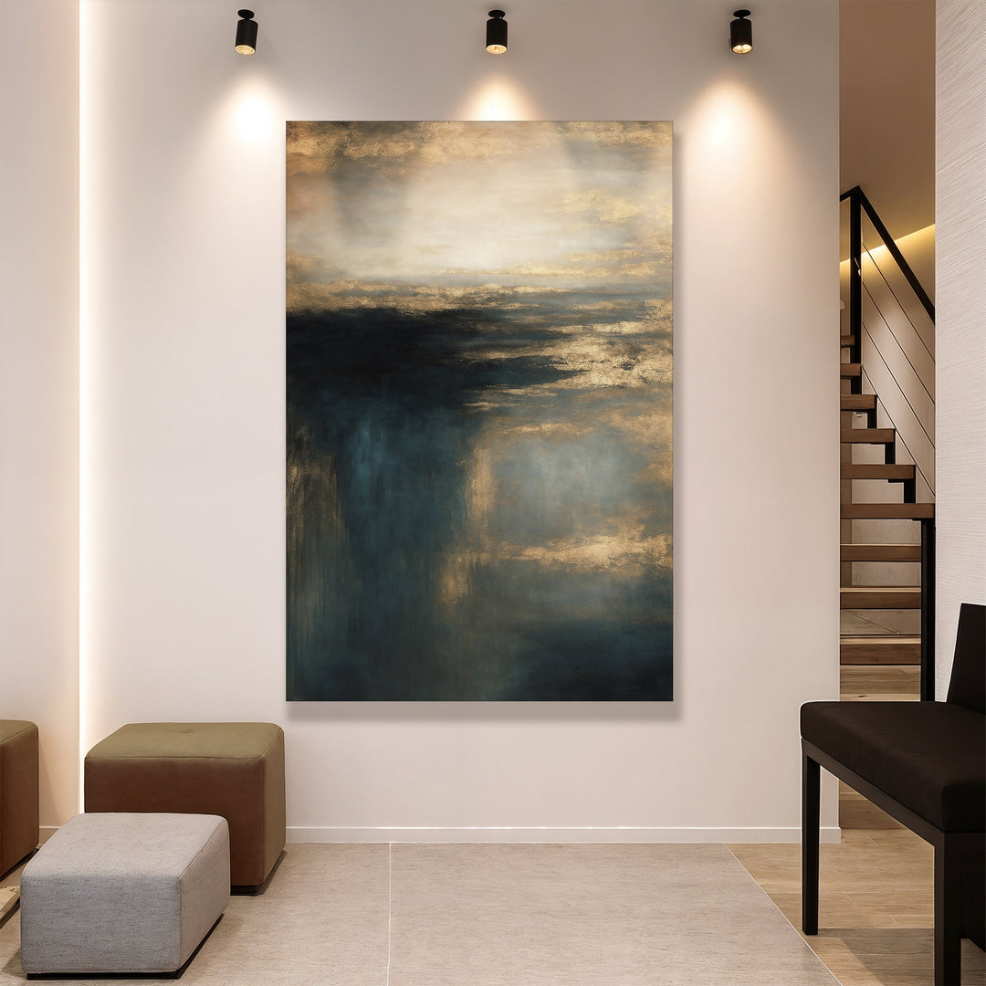 Vertical cloudscape wall art canvas with gold sky and teal mist, displayed on wall.