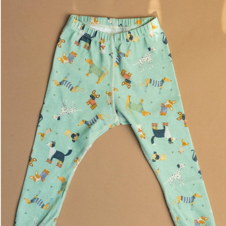 Teal pajama pants with elastic waistband, orange accents, and animal print pattern