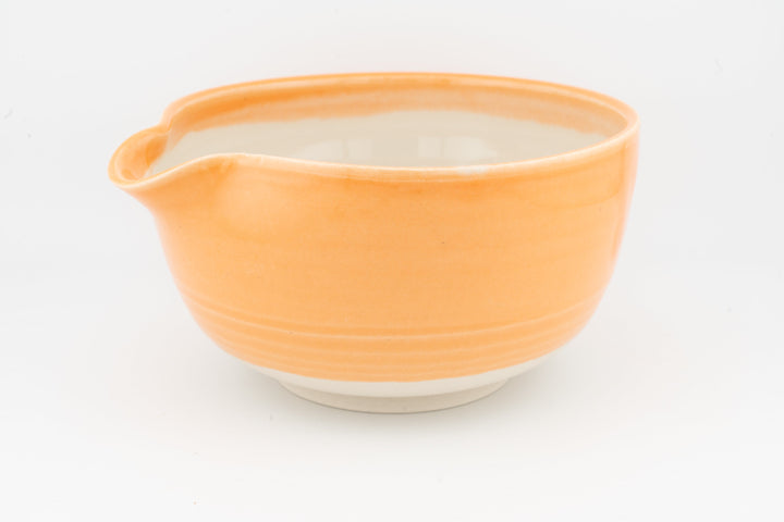 Ceramic bowl with optional spout, orange glaze, curved rim with side spout