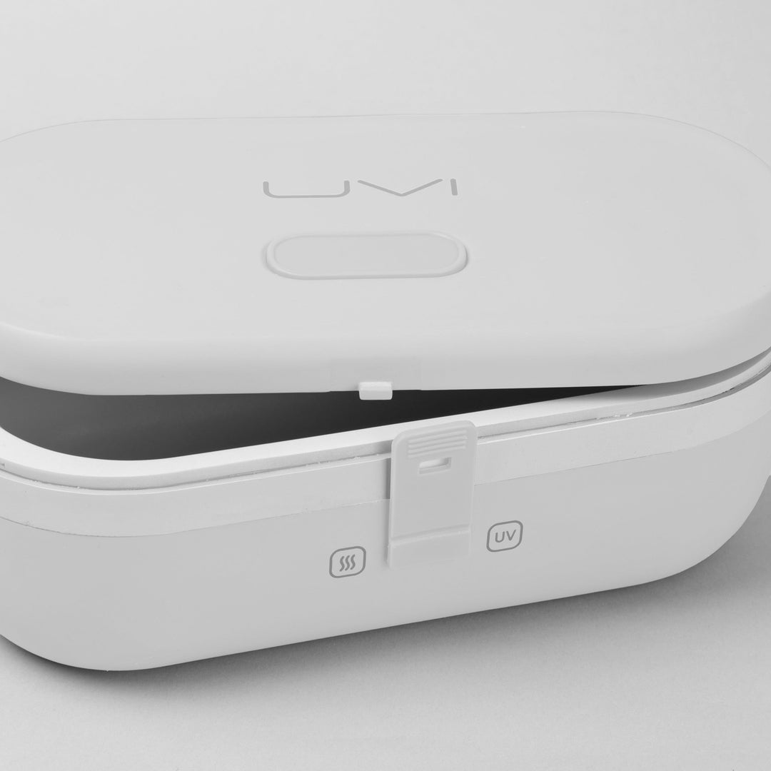 White self-heating lunch box with UV panel and heating icon on side, lid closed