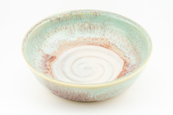 Turquoise speckled ceramic cat dish with orange interior rim