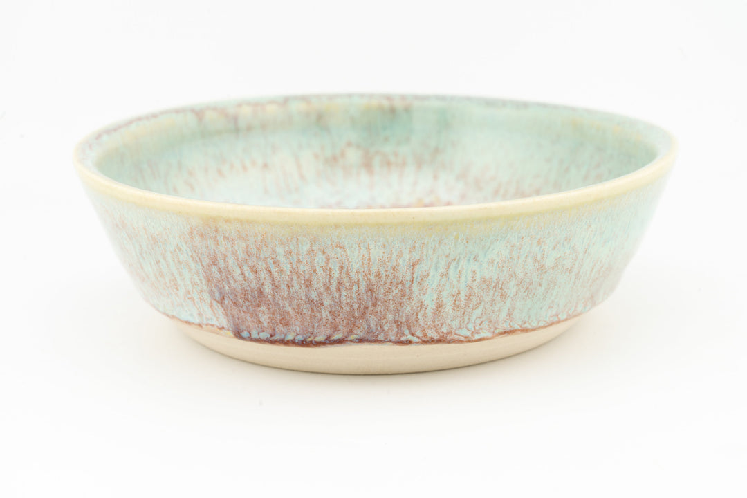 Turquoise glazed ceramic cat dish with speckled finish