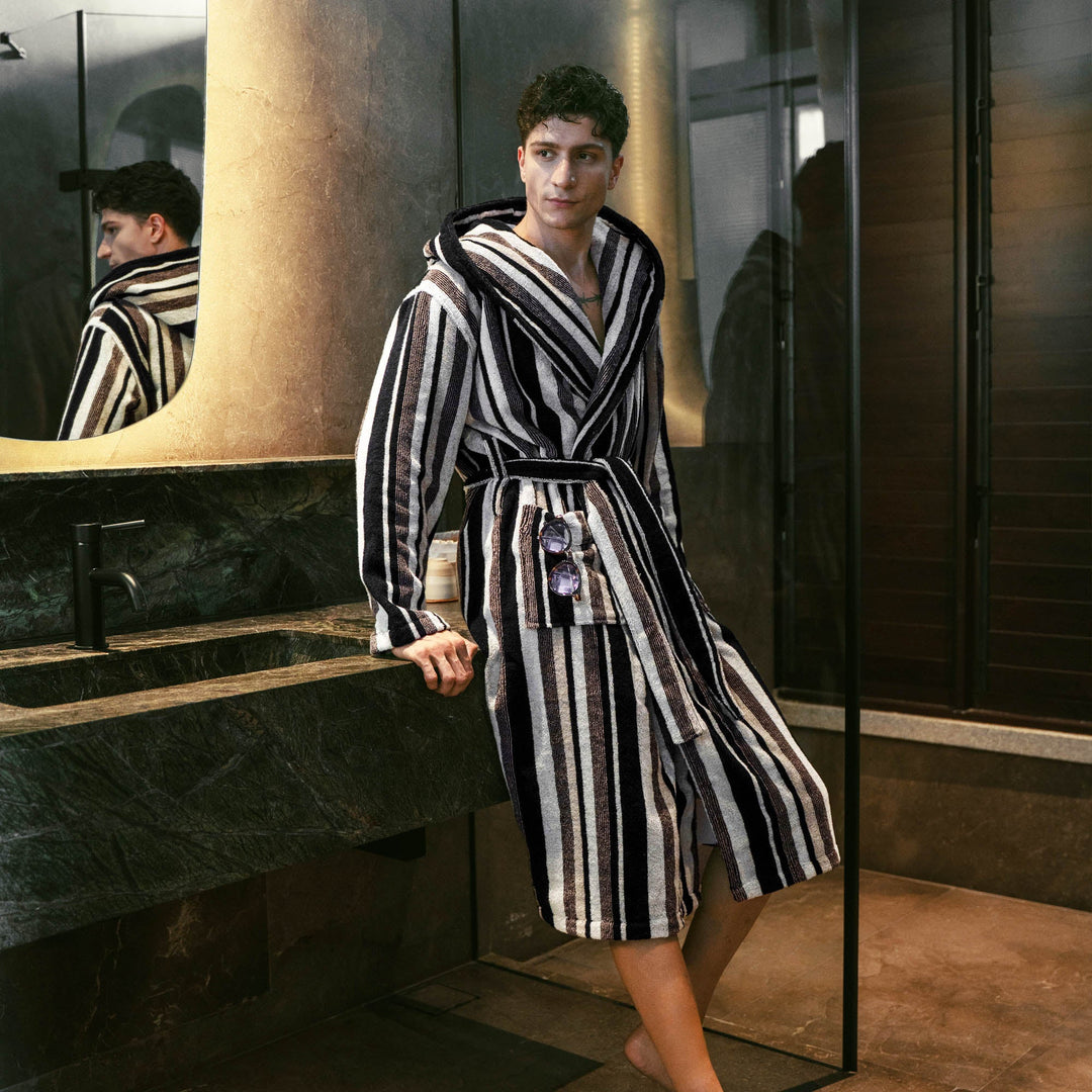 Black-and-white striped bathrobe with hood and belt, long sleeves, textured terry