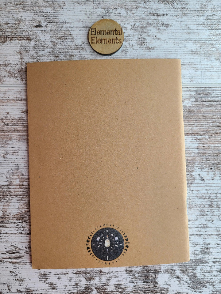 Brown journal back cover with dark moon icon stamp