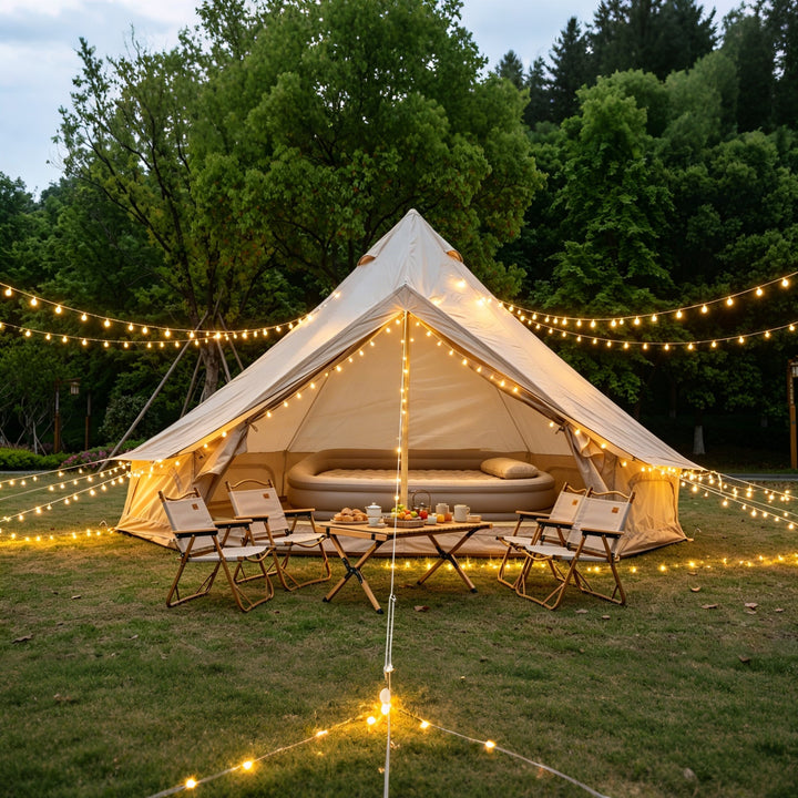 Bell glamping tent with open front doorway and beige interior, white outer canvas