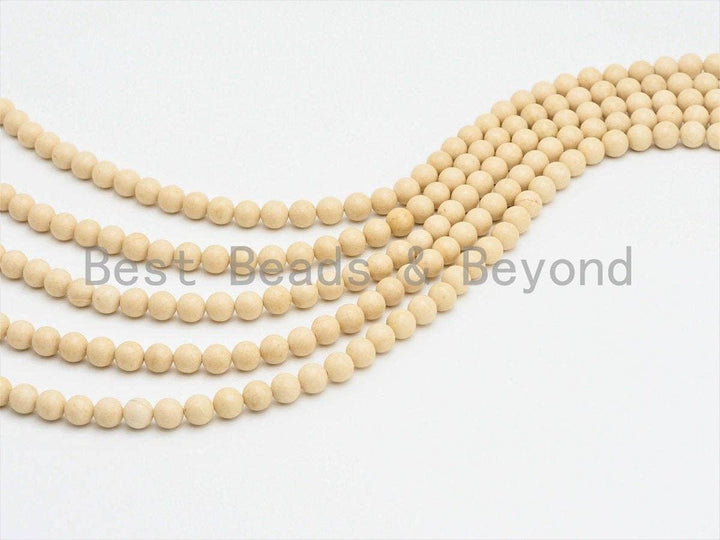 Cream round smooth agate bead strand, two curved loops of uniform round beads