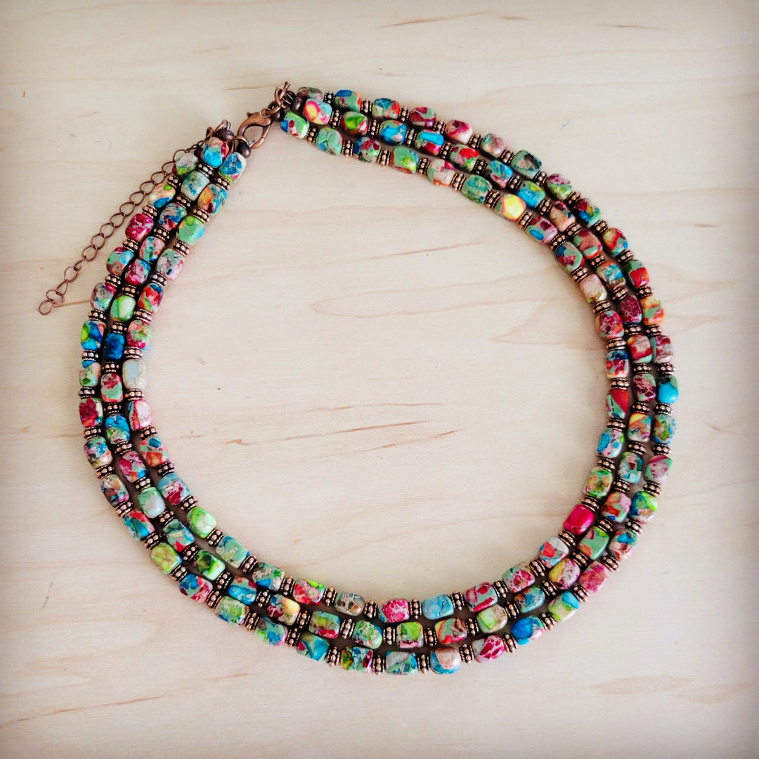 Triple-strand beaded boho necklace with iridescent multi-color rectangle beads and clasp