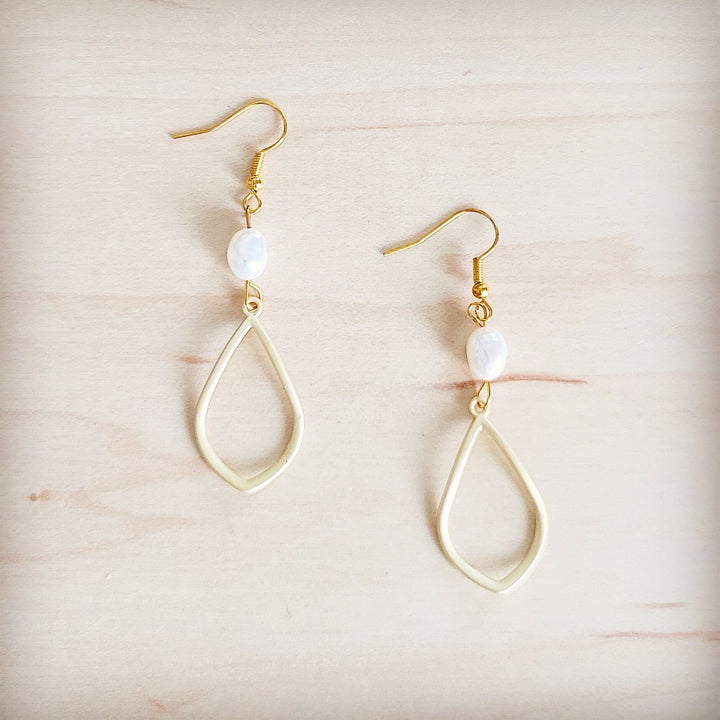 Gold drop earrings with teardrop frame and white freshwater pearl dangle