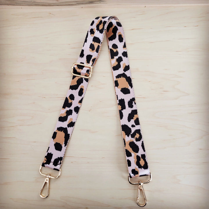 Leopard-print crossbody strap with two adjustable buckles and gold-tone clips