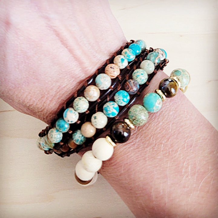 Hand wearing beaded leather double-wrap bracelet with turquoise and white stone-look beads