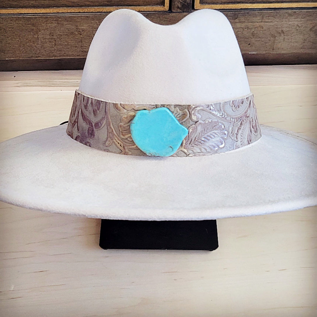 White felt cowboy hat with wide leather band and turquoise inlay centerpiece